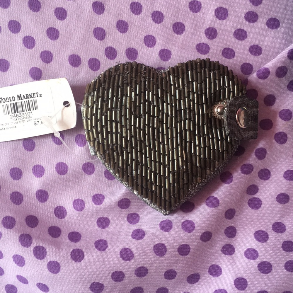 This is a heart shaped travel size mirror.
